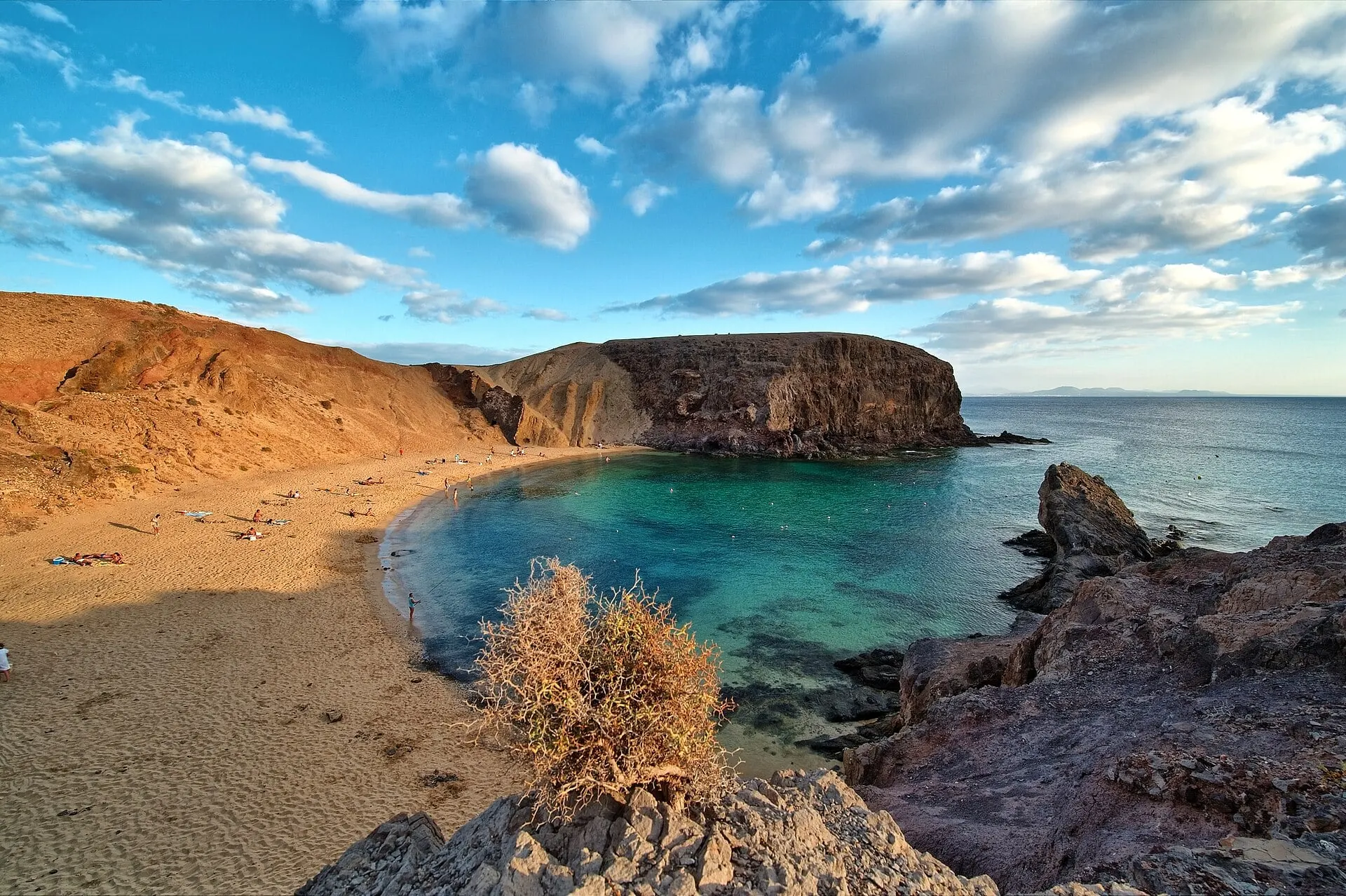Papagayo beach on Lanzarote's south coast, a cove of turquoise water below ochre cliffs