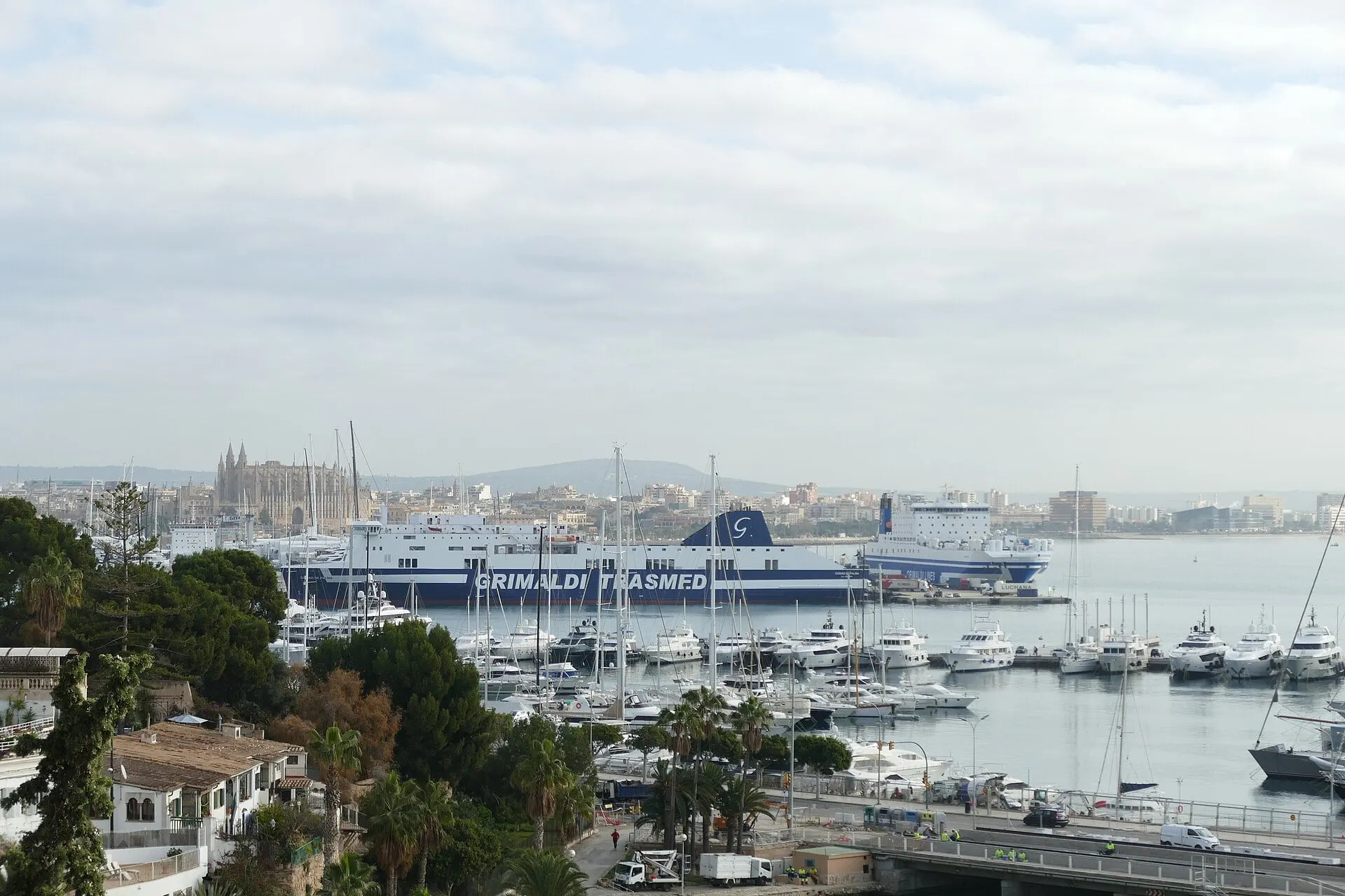 La Seu across the harbour, rising over the old town of Palma behind a Grimaldi Trasmed ferry at its berth.