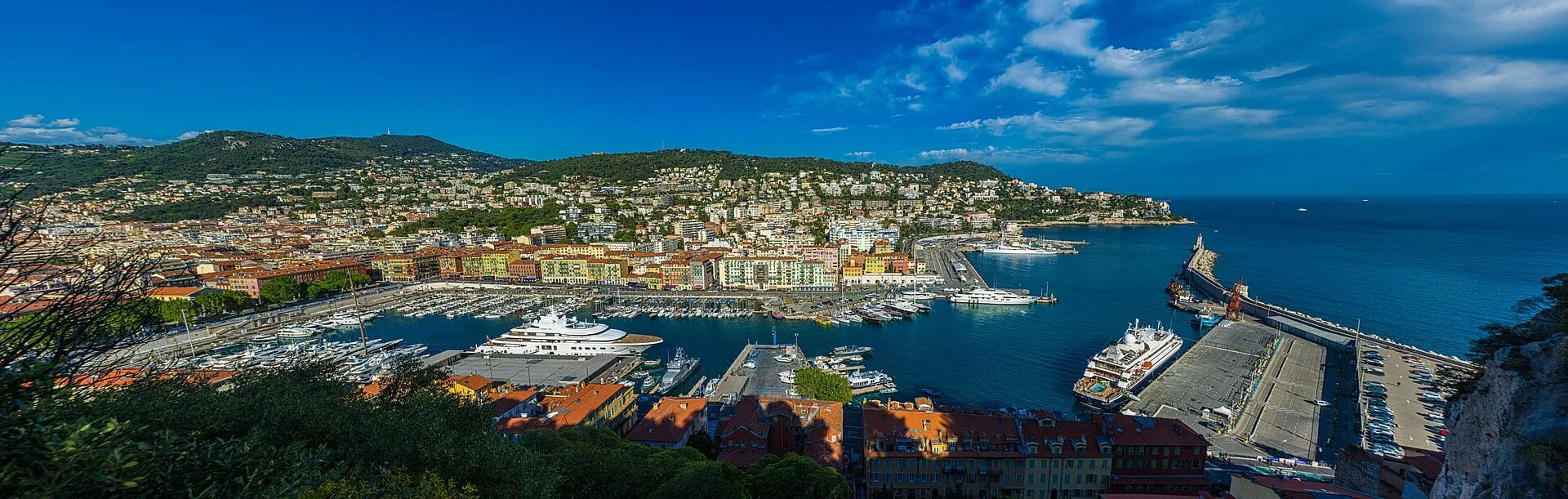 Port Lympia in Nice from above, with ferries at the commercial quay and the hills of Nice behind