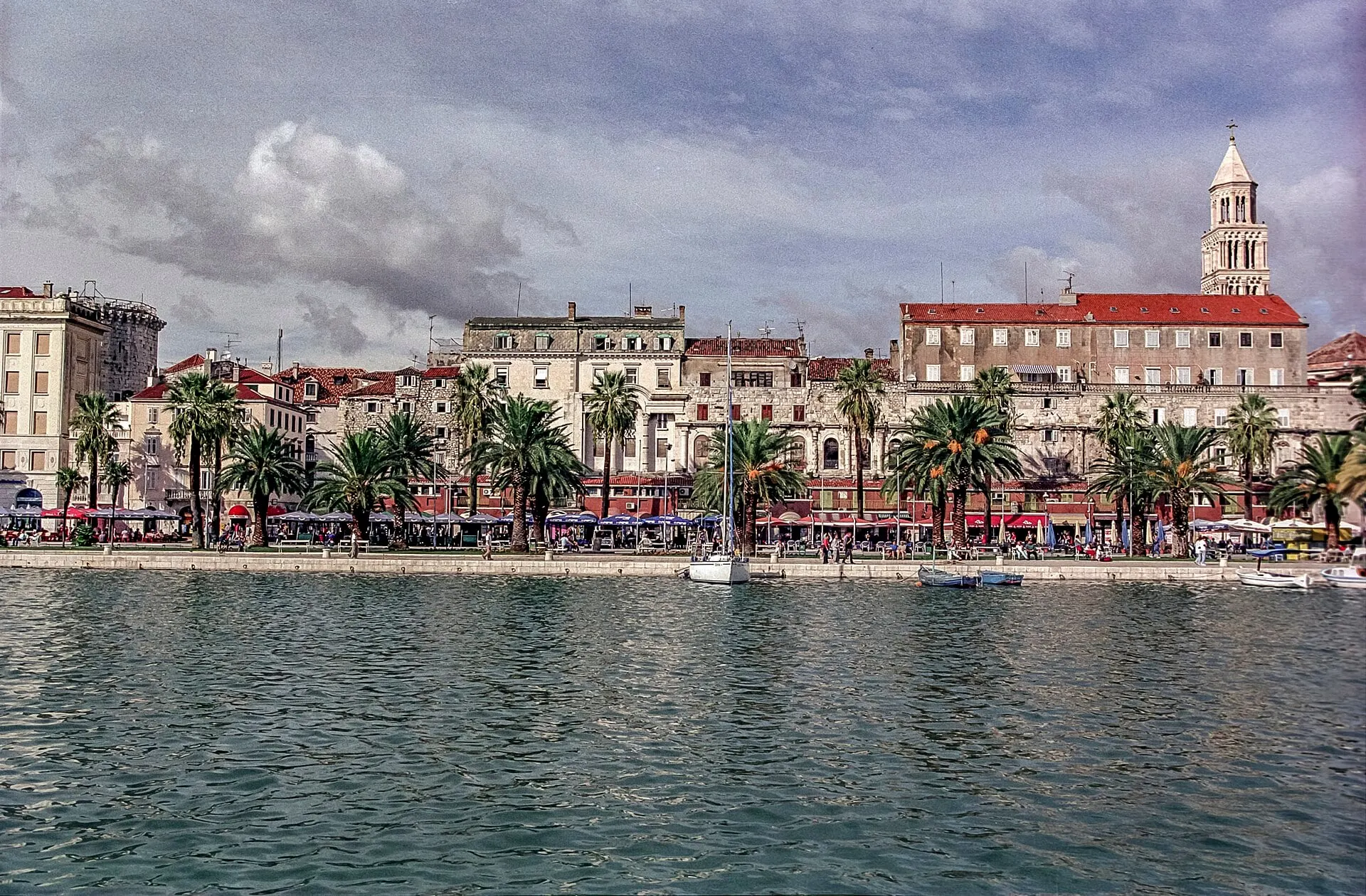 Split's palm lined waterfront and the bell tower of Diocletian's palace seen from the sea