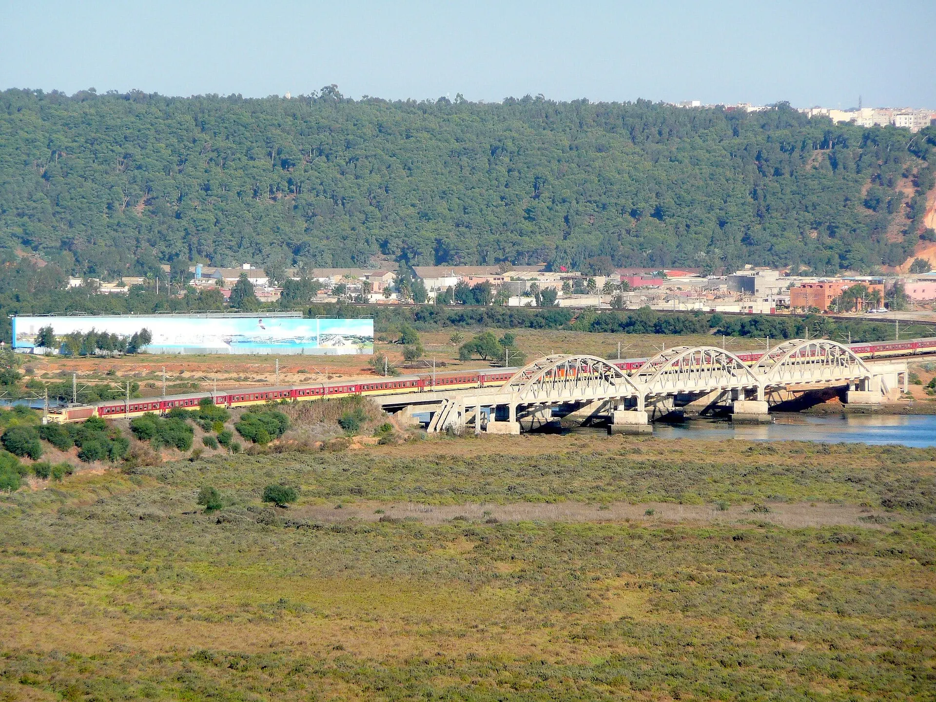 Two trains passing on the arched railway bridge across the Bou Regreg between Salé and Rabat