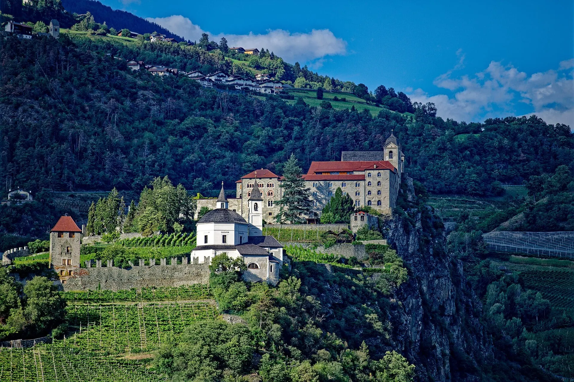 The convent of Säben on its rock above Klausen, with vineyards on the slopes below