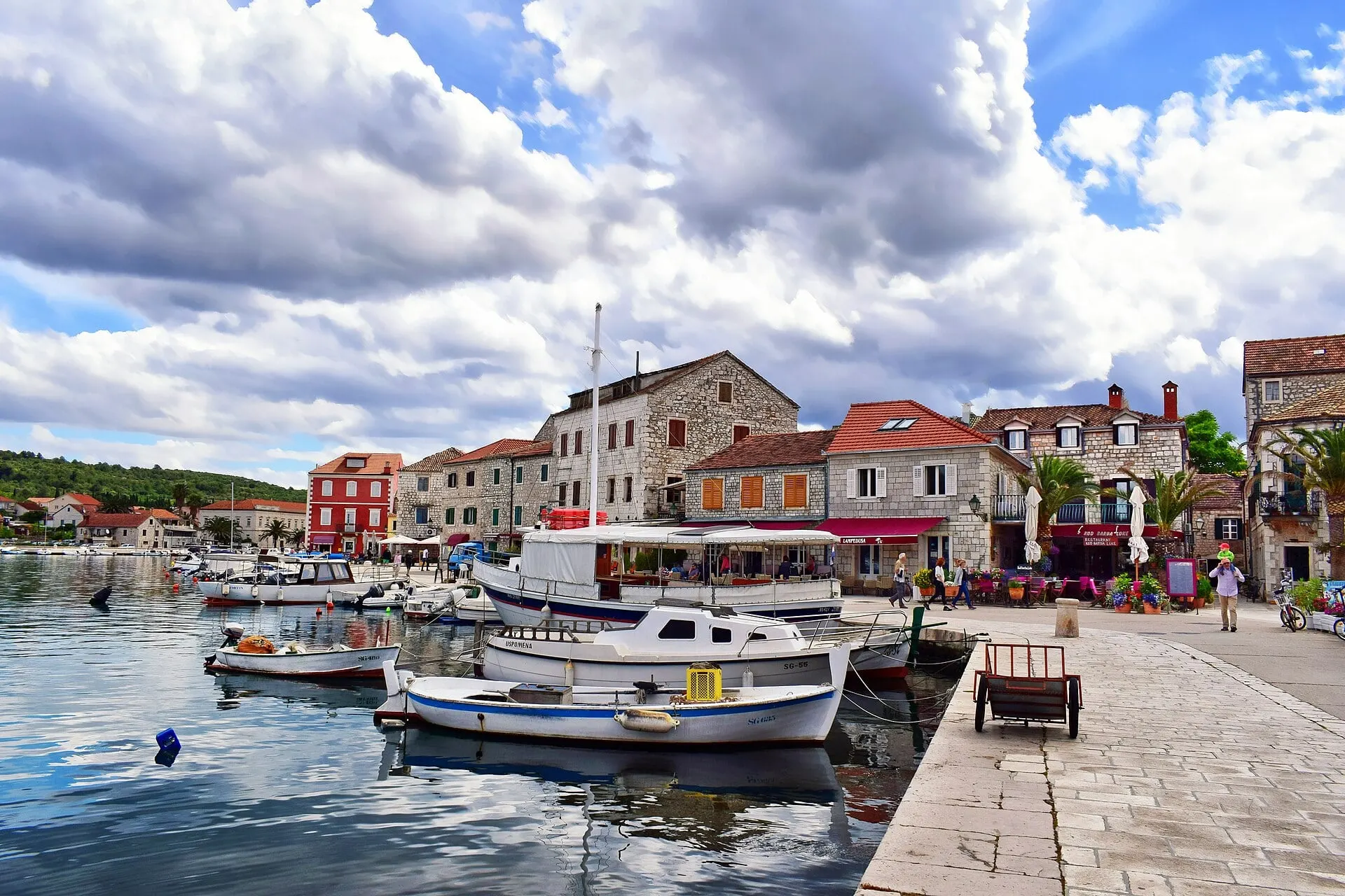 Fishing boats moored along the stone quay of Stari Grad on Hvar.