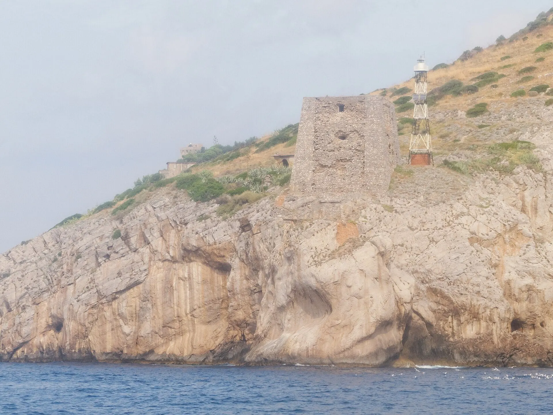 The tower and lighthouse on Punta Campanella seen from the sea