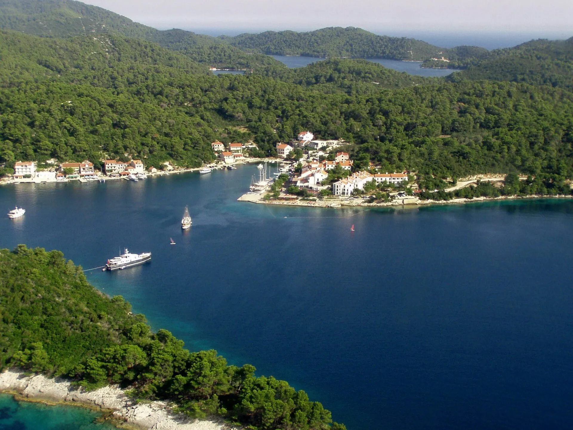 Pomena on Mljet, its bay and pine woods at the edge of Mljet National Park