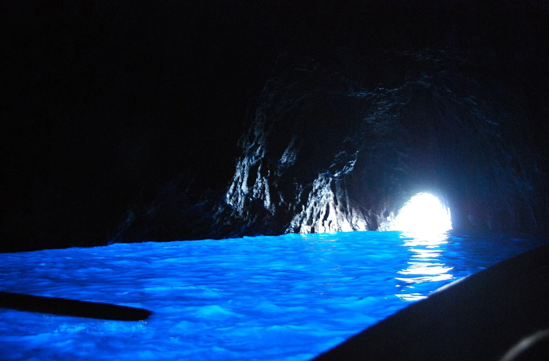 The glowing blue water inside the Blue Grotto on Capri