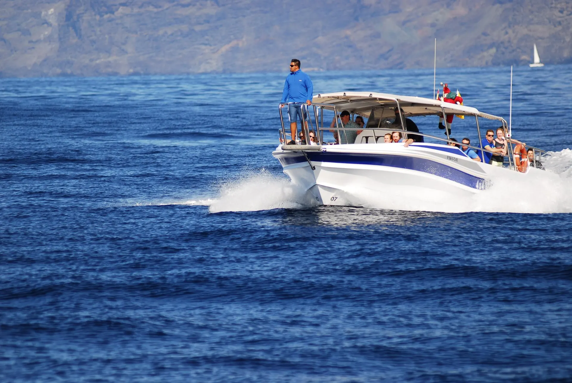 The speedboat crossing open water off the west coast