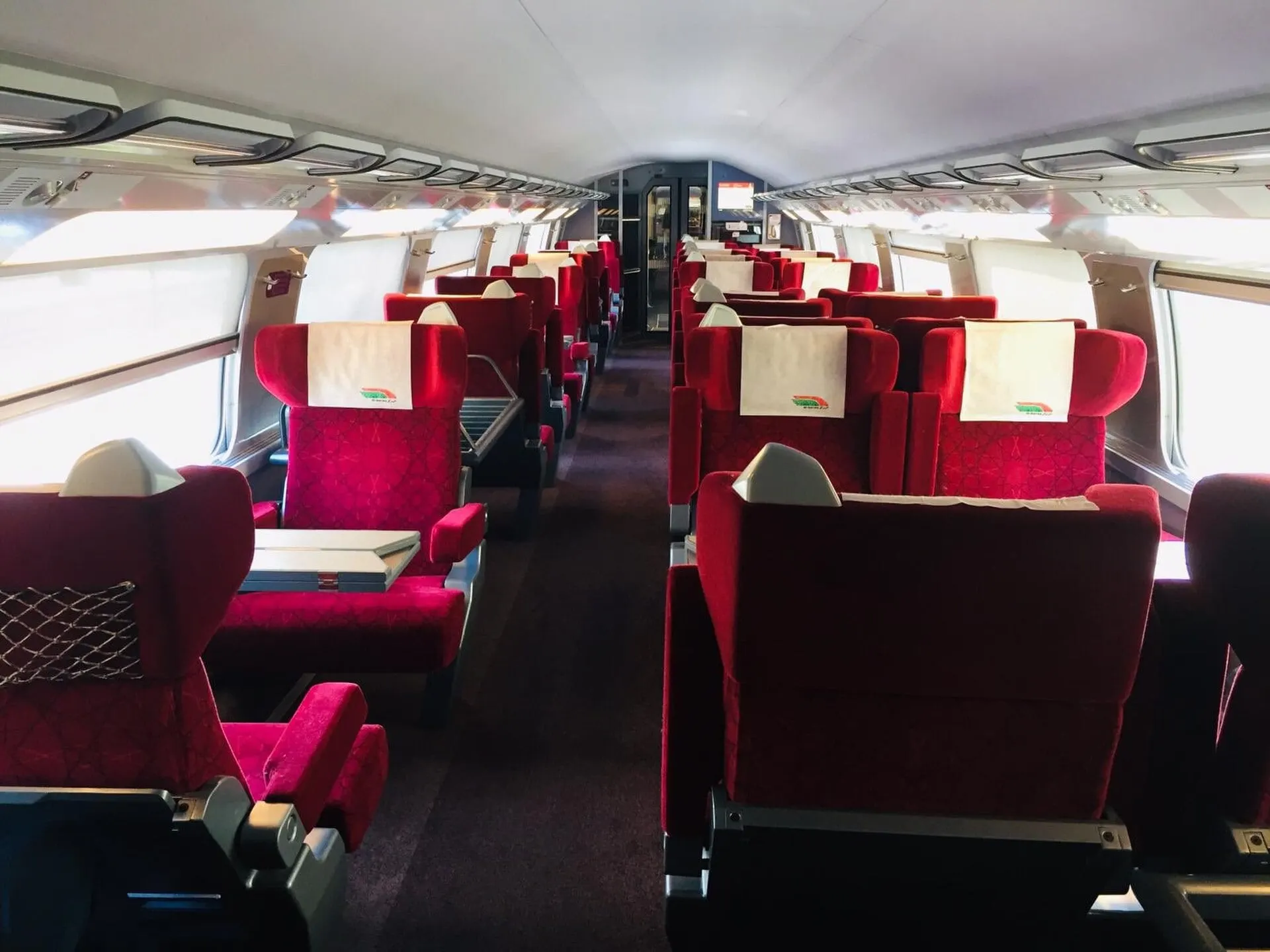 Red first class seats in a carriage of the Al Boraq train