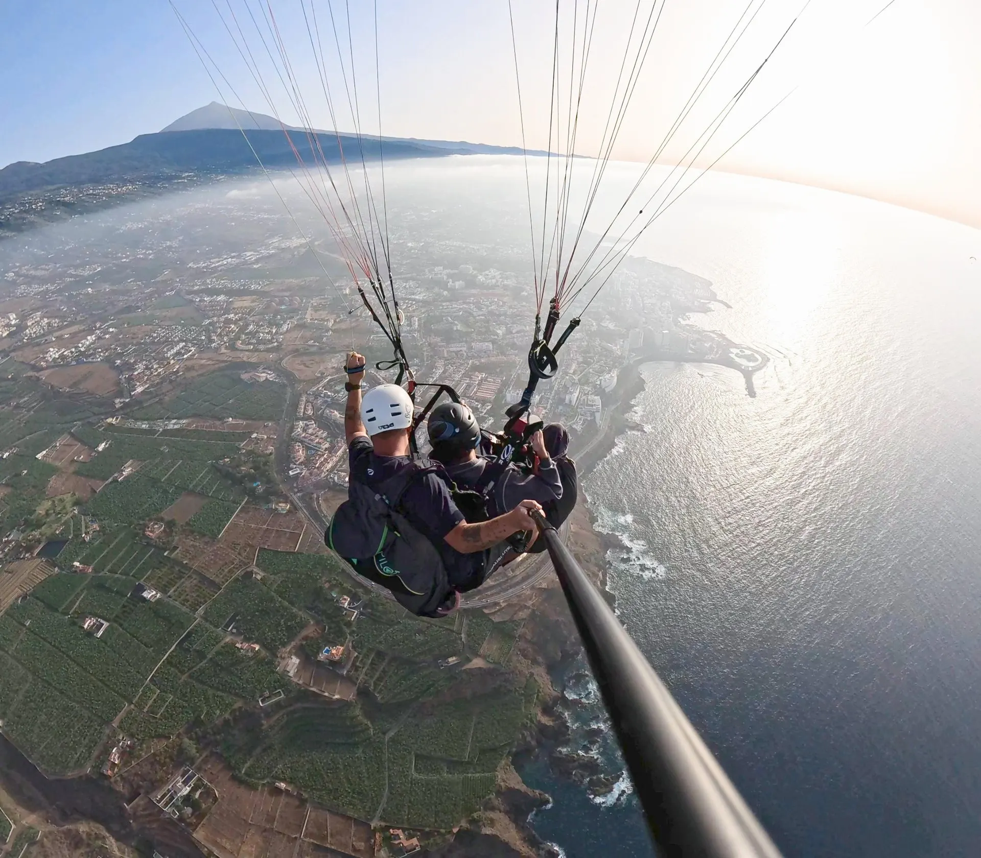 A tandem pair over the north coast, with Teide and the Orotava valley behind