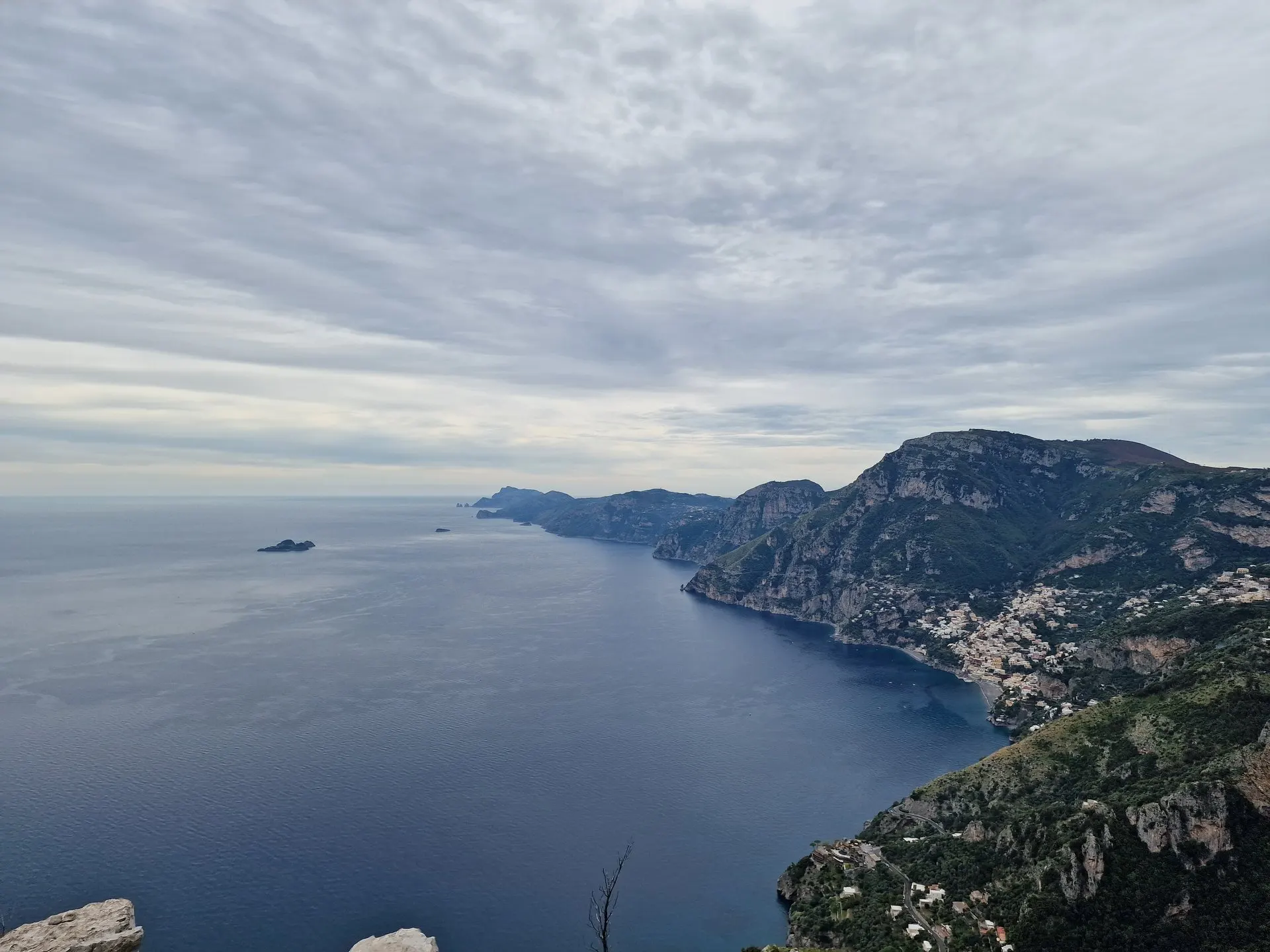 The coast below the Path of the Gods, looking west over Positano towards the Li Galli islets and the Sorrento peninsula