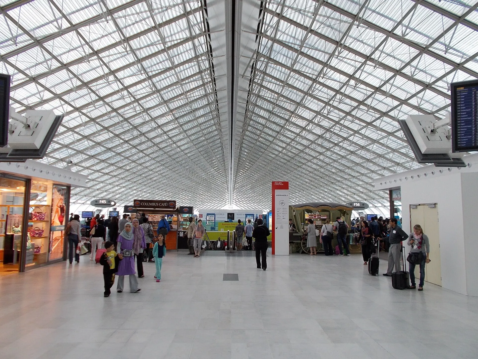 Inside Terminal 2F at Paris Charles de Gaulle, under its long glass roof