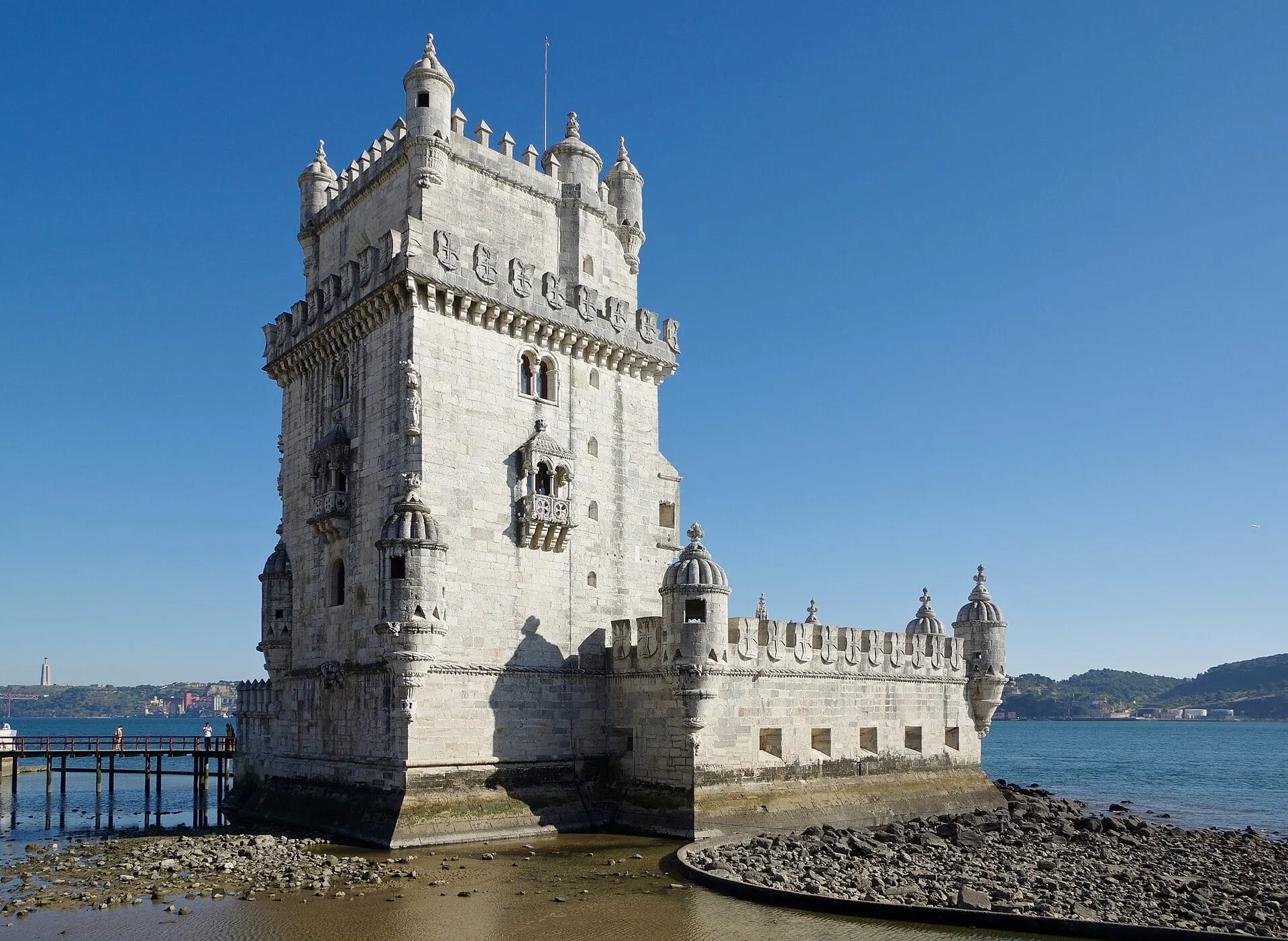 Belém Tower standing in the Tagus at low tide, the river beyond