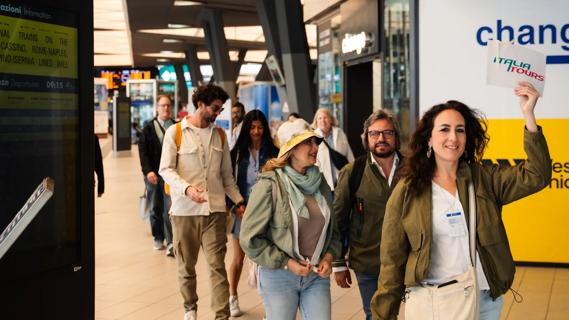 A guide leading her group through the station