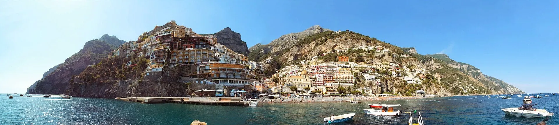 The ferry arrival view of Positano's beach and hillside houses from the water