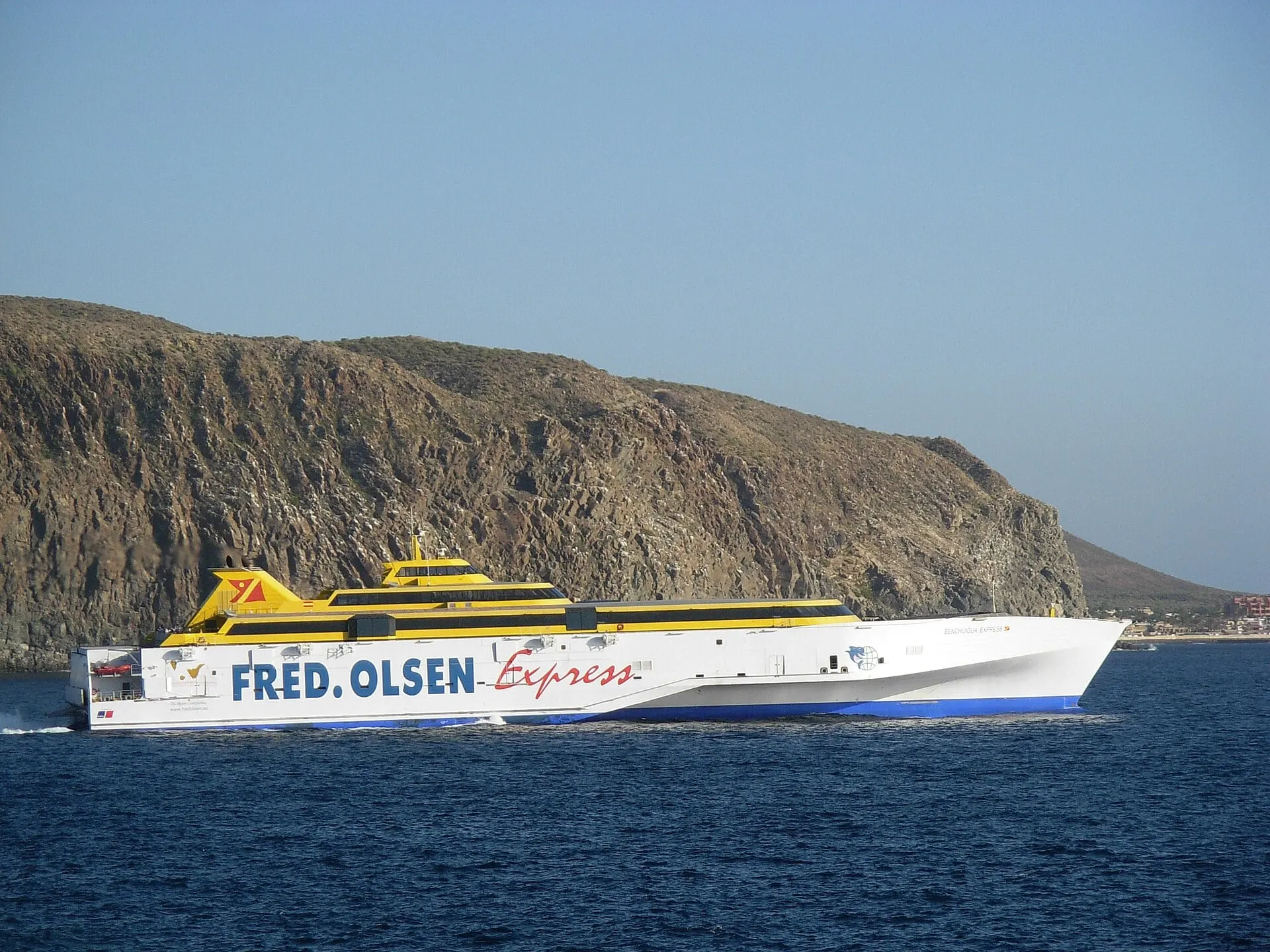 The Fred. Olsen trimaran Benchijigua Express at speed off the coast at Los Cristianos.