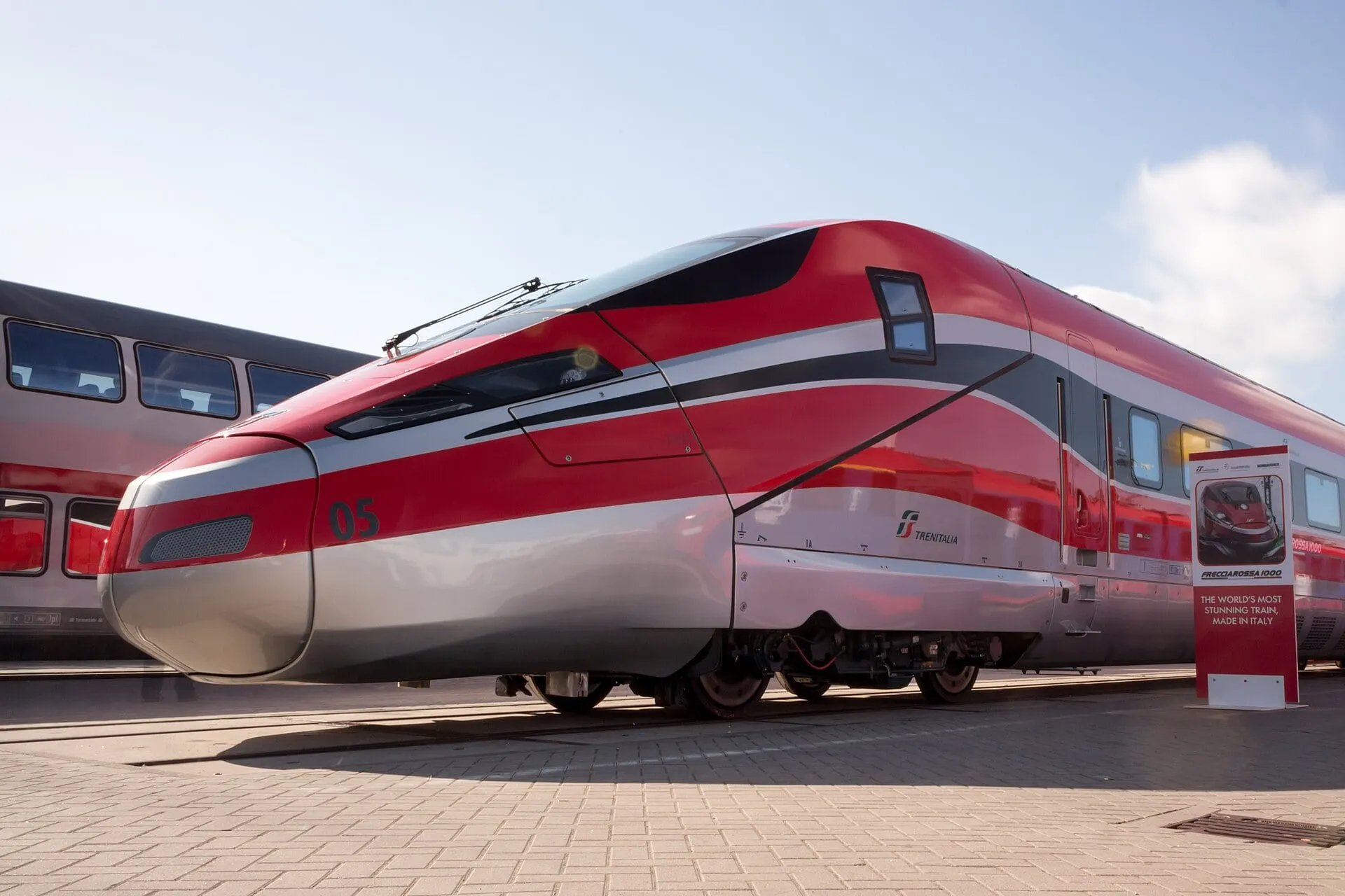 A red Frecciarossa 1000 high-speed train, the fastest service from Rome towards Salerno