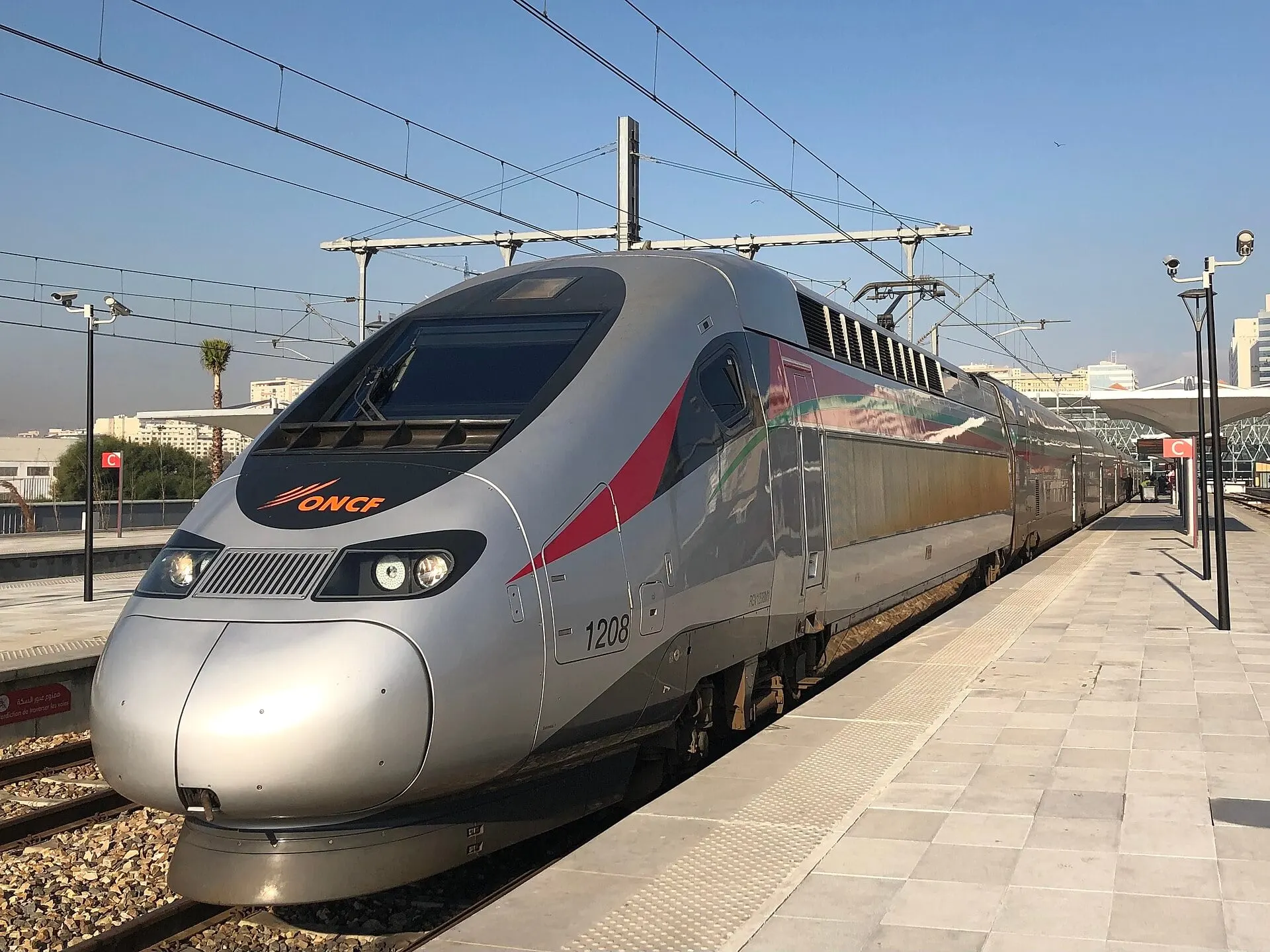 Al Boraq train 1208 at the platform in Tangier under a clear blue sky