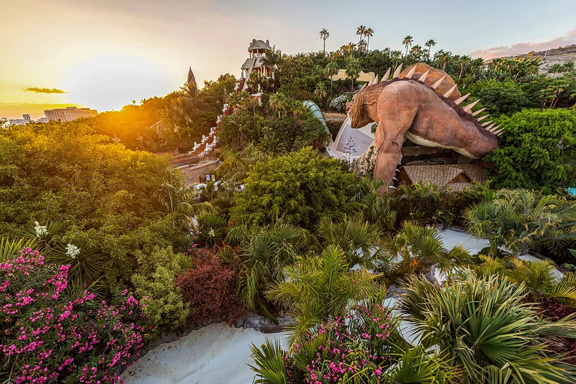 The dragon-topped slides of Siam Park at sunset
