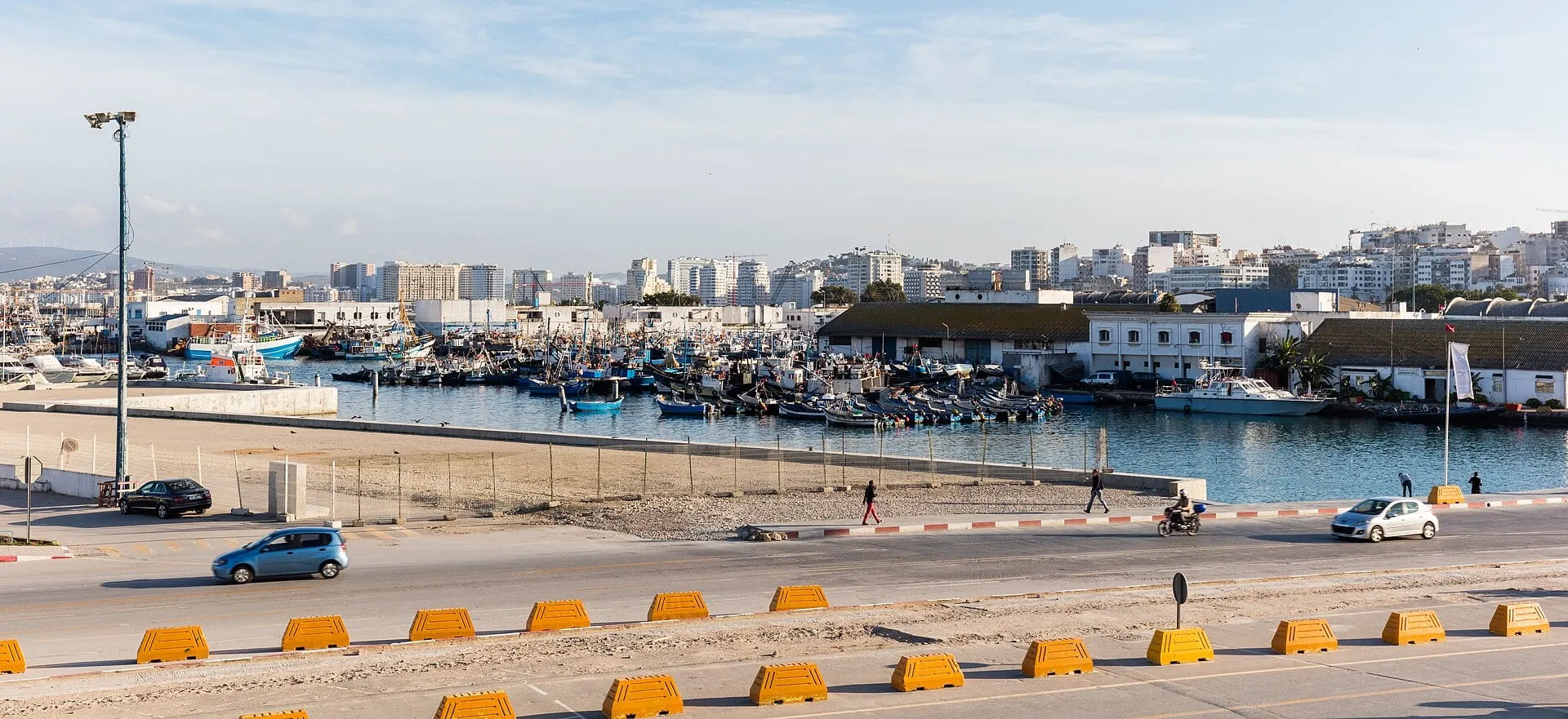 The port of Tangier with fishing boats and the city rising behind