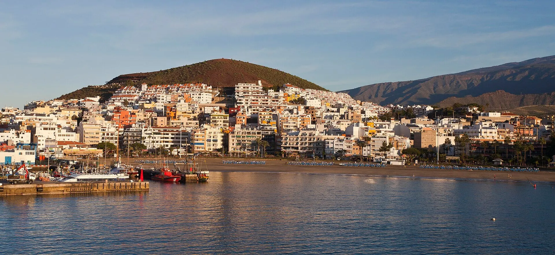 Los Cristianos and its harbour in low morning sun, the departure port on Tenerife.