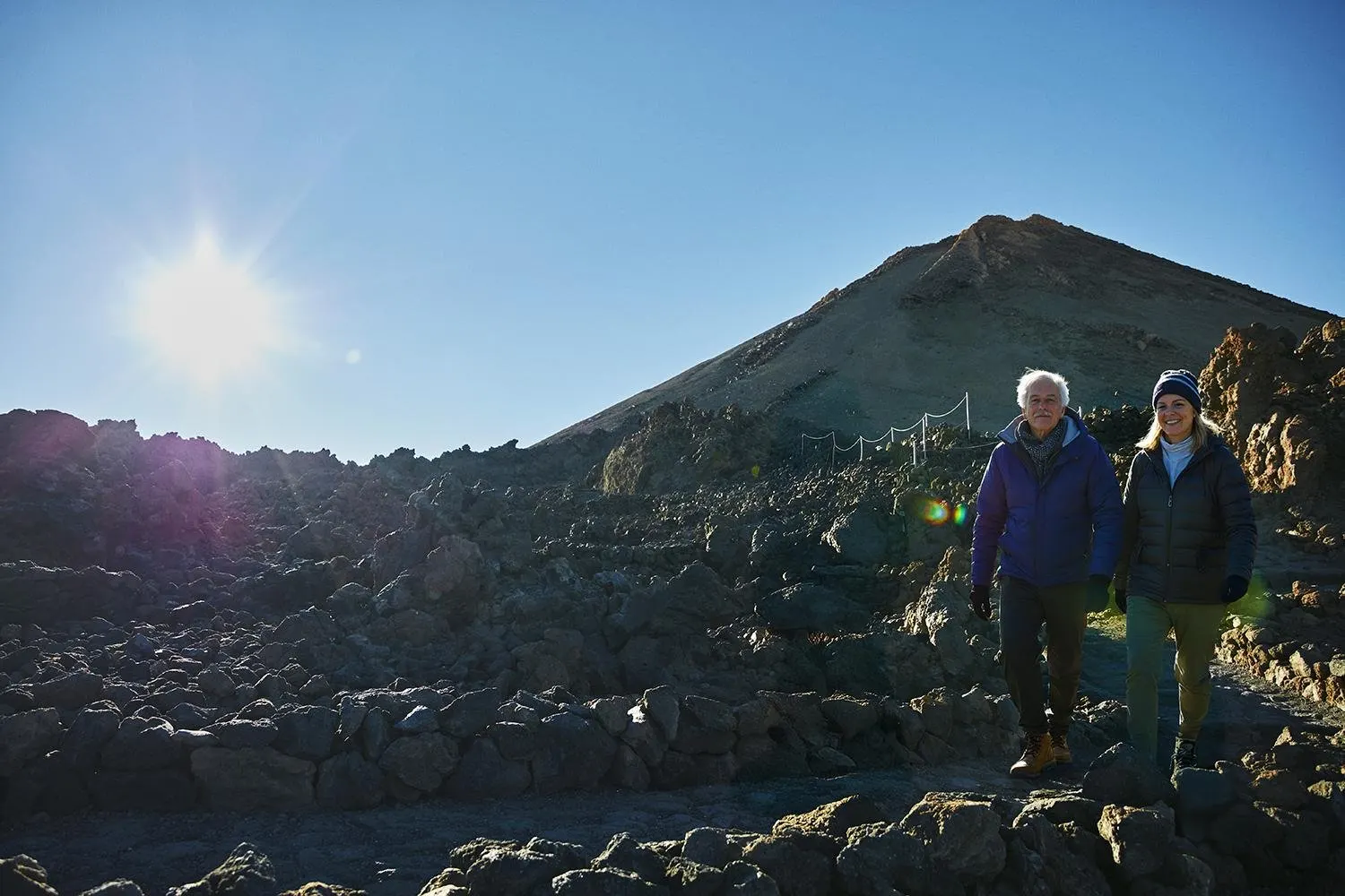 Two hikers on a trail below Teide's summit cone