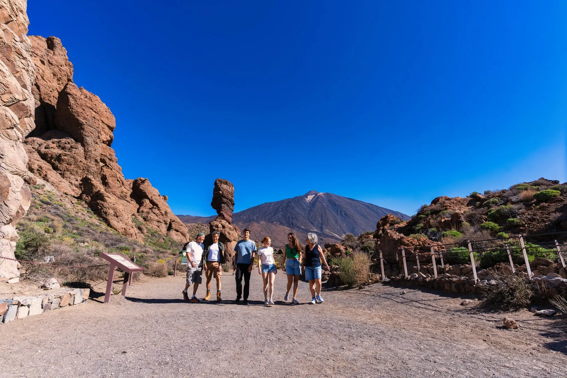 A group walking at Roques de García, with Teide in the background