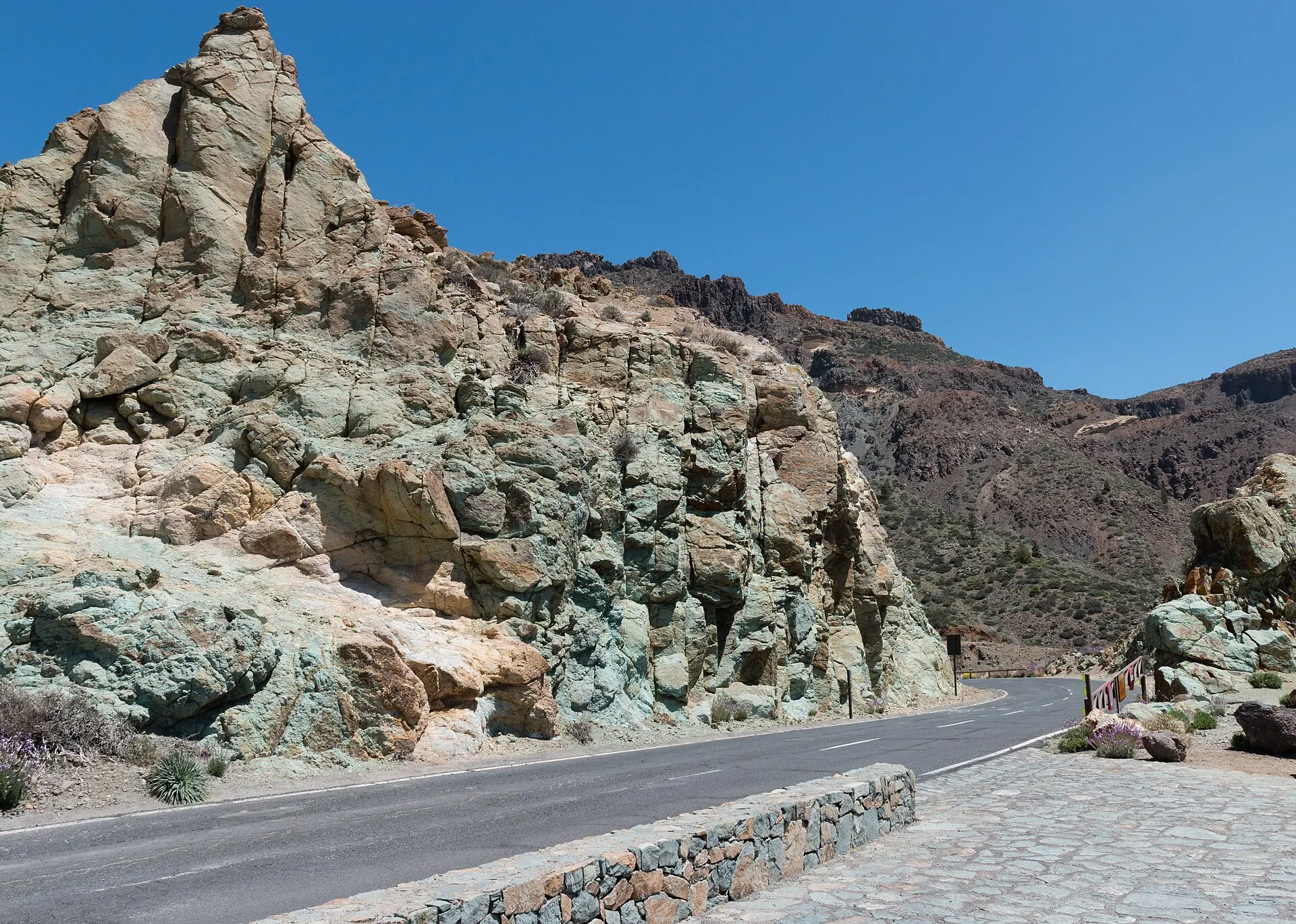 Rock stained green and blue by hot volcanic fluids at Los Azulejos, beside the TF-21 in Teide National Park