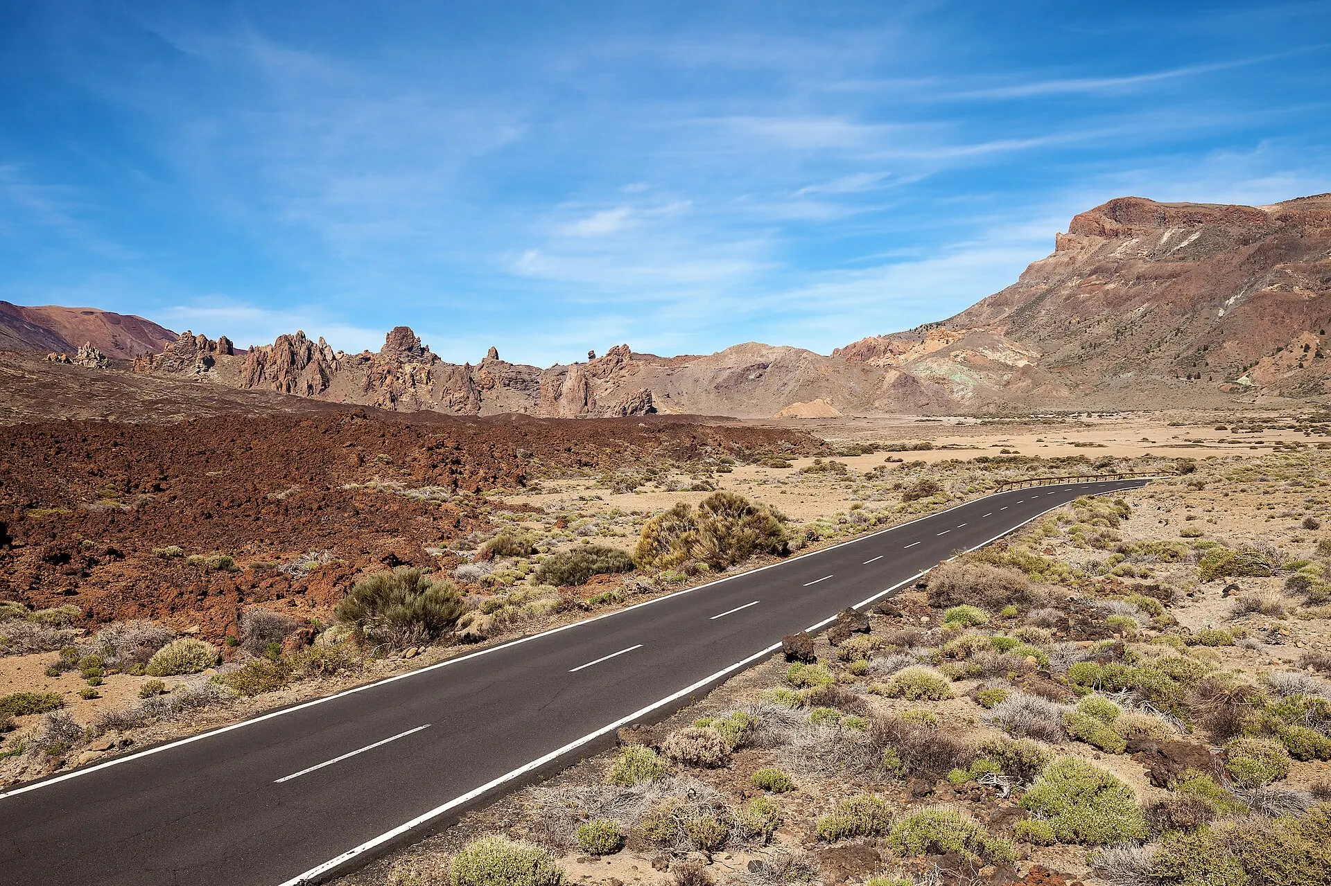 The TF-21 crossing the Las Cañadas caldera in Teide National Park, past the Roques de García and a lava field