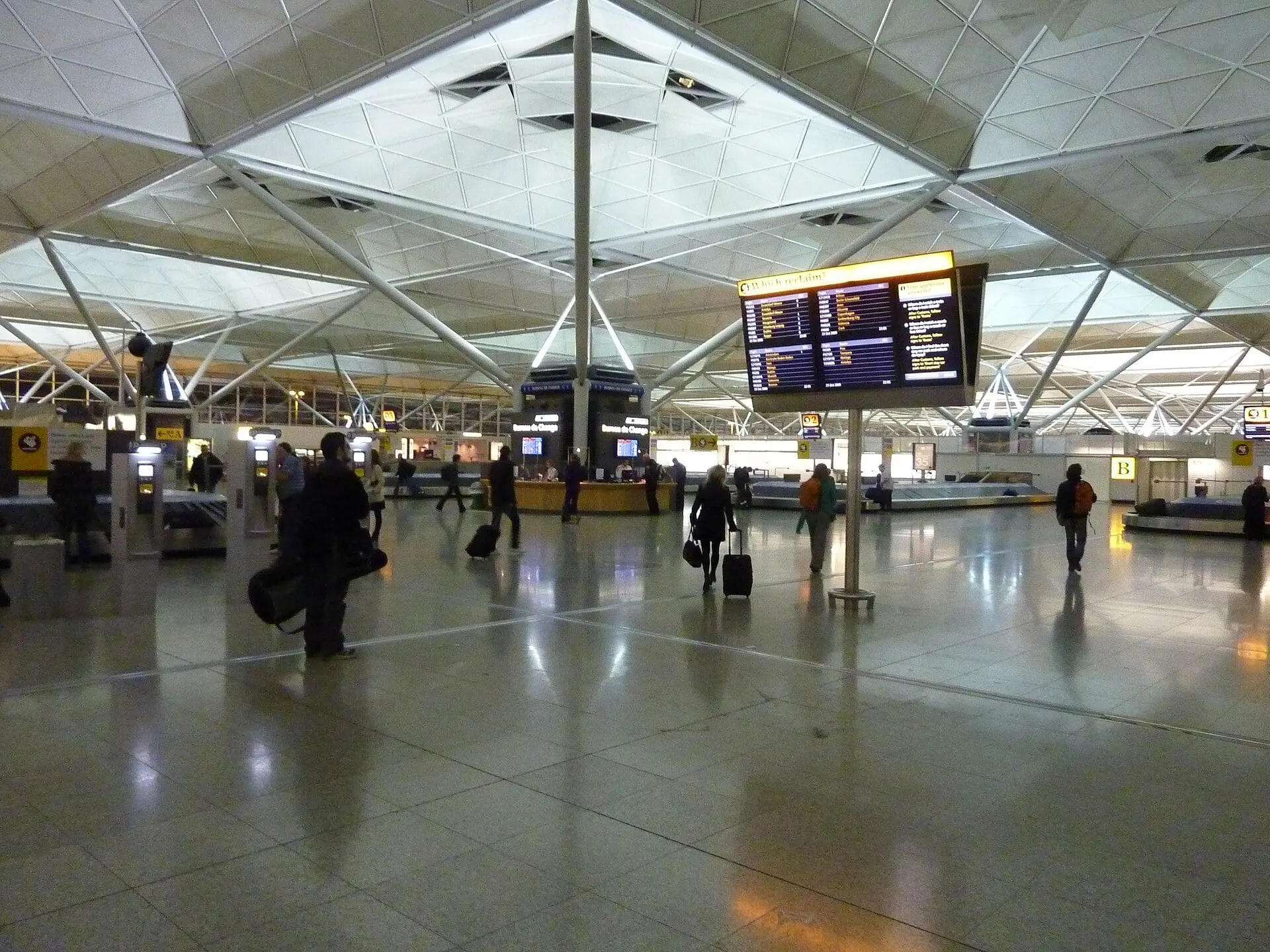 The main hall inside Stansted Airport terminal, under its lattice roof