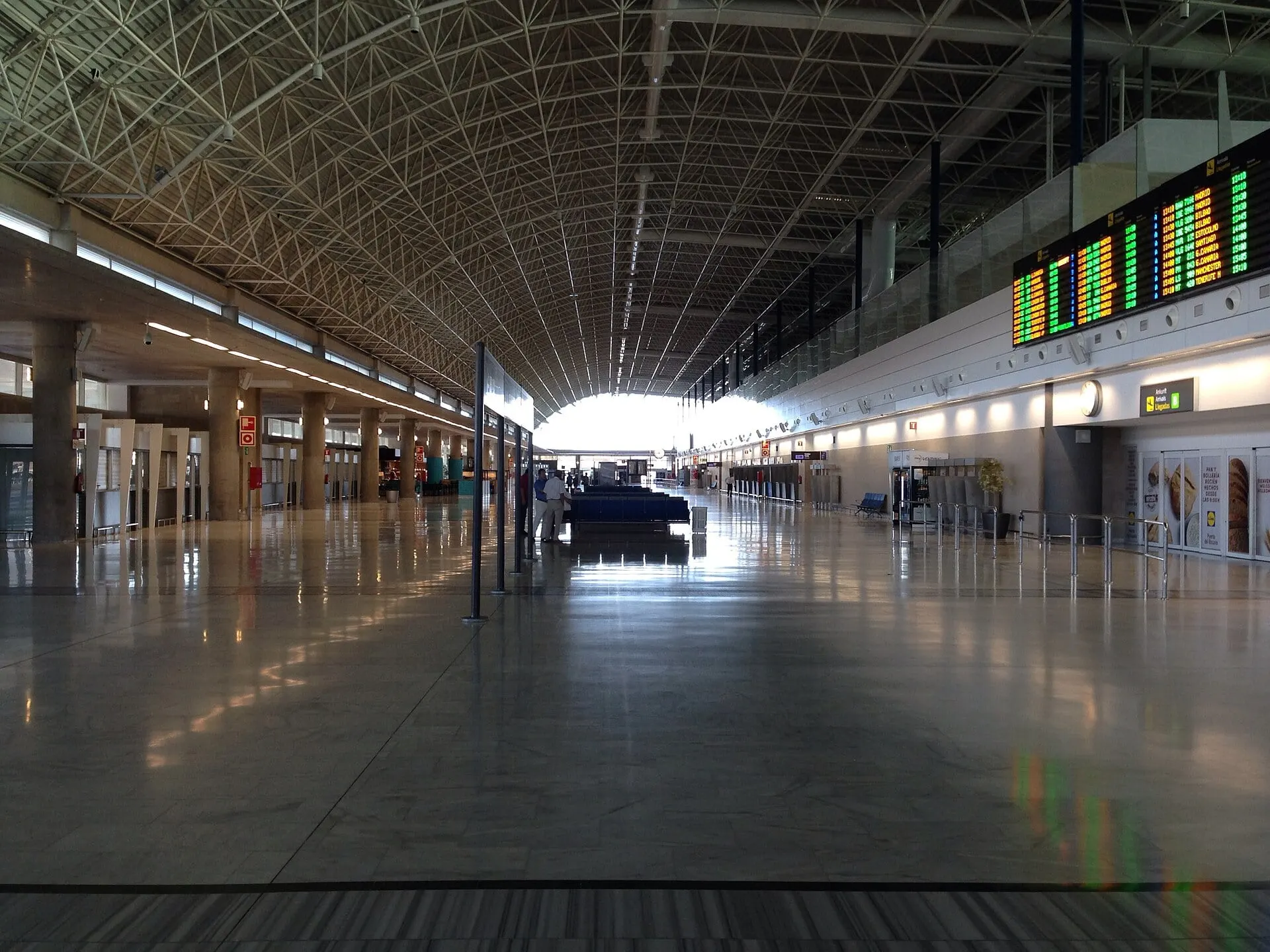 The long check-in hall on Floor 0 of the terminal at Fuerteventura Airport, under its arched steel roof