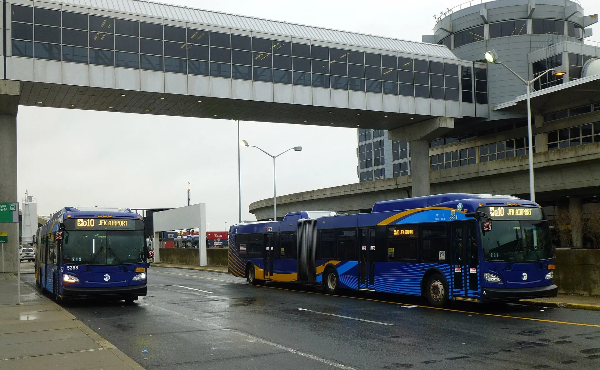 New York City buses waiting at the Terminal 4 bus stop at JFK
