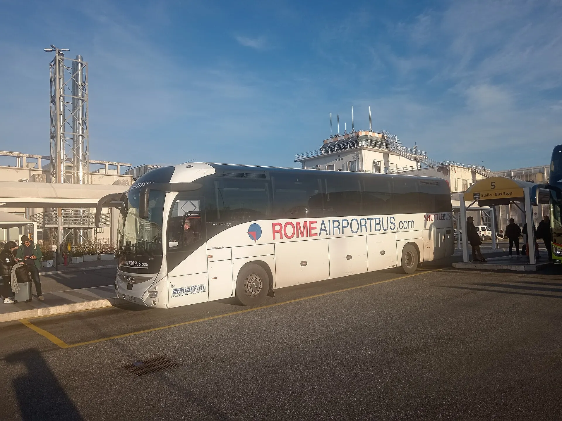 A coach to central Rome waiting at the bus stops outside Ciampino Airport