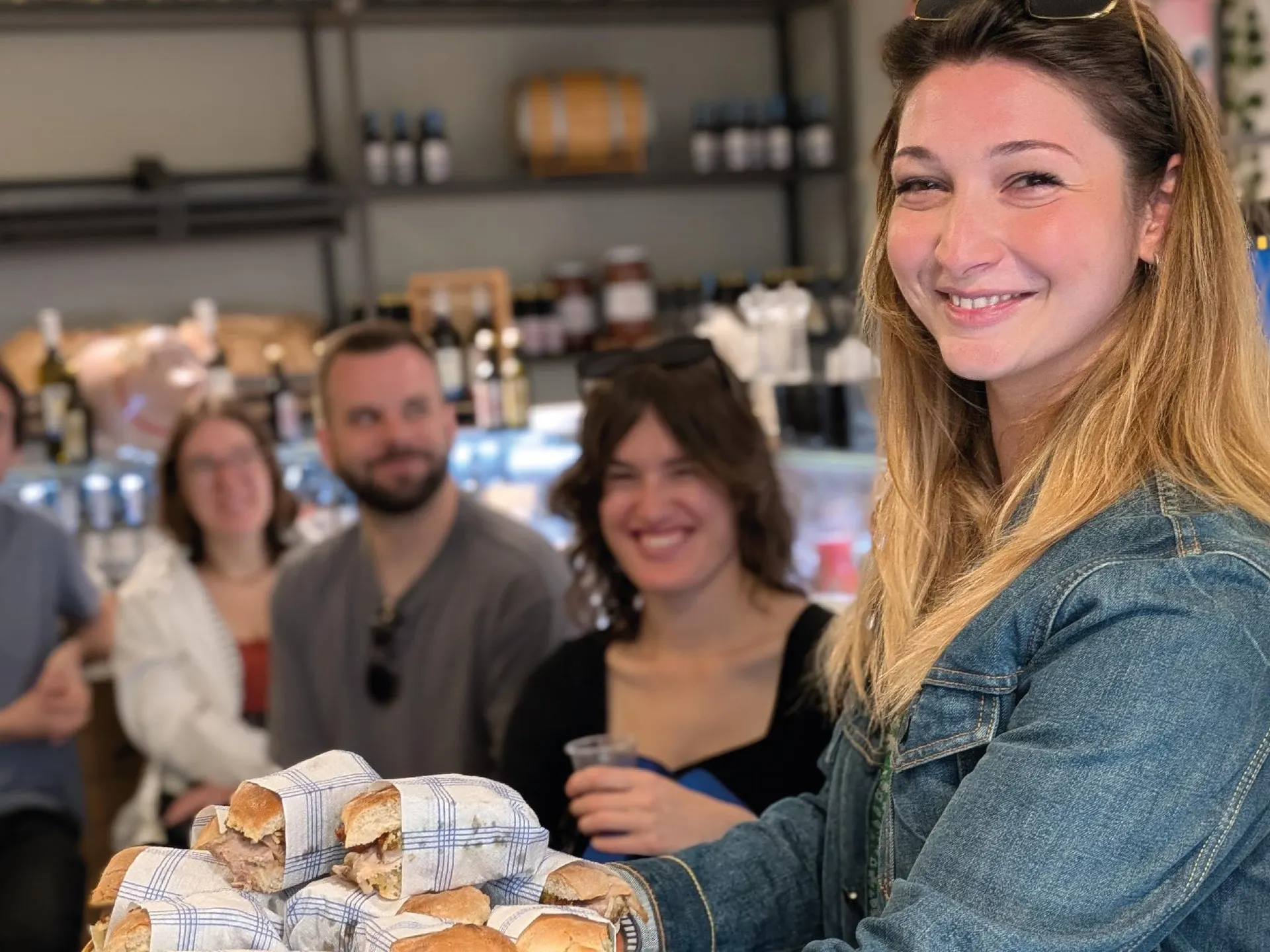 A guest holding a tray of Roman sandwiches on the food tour