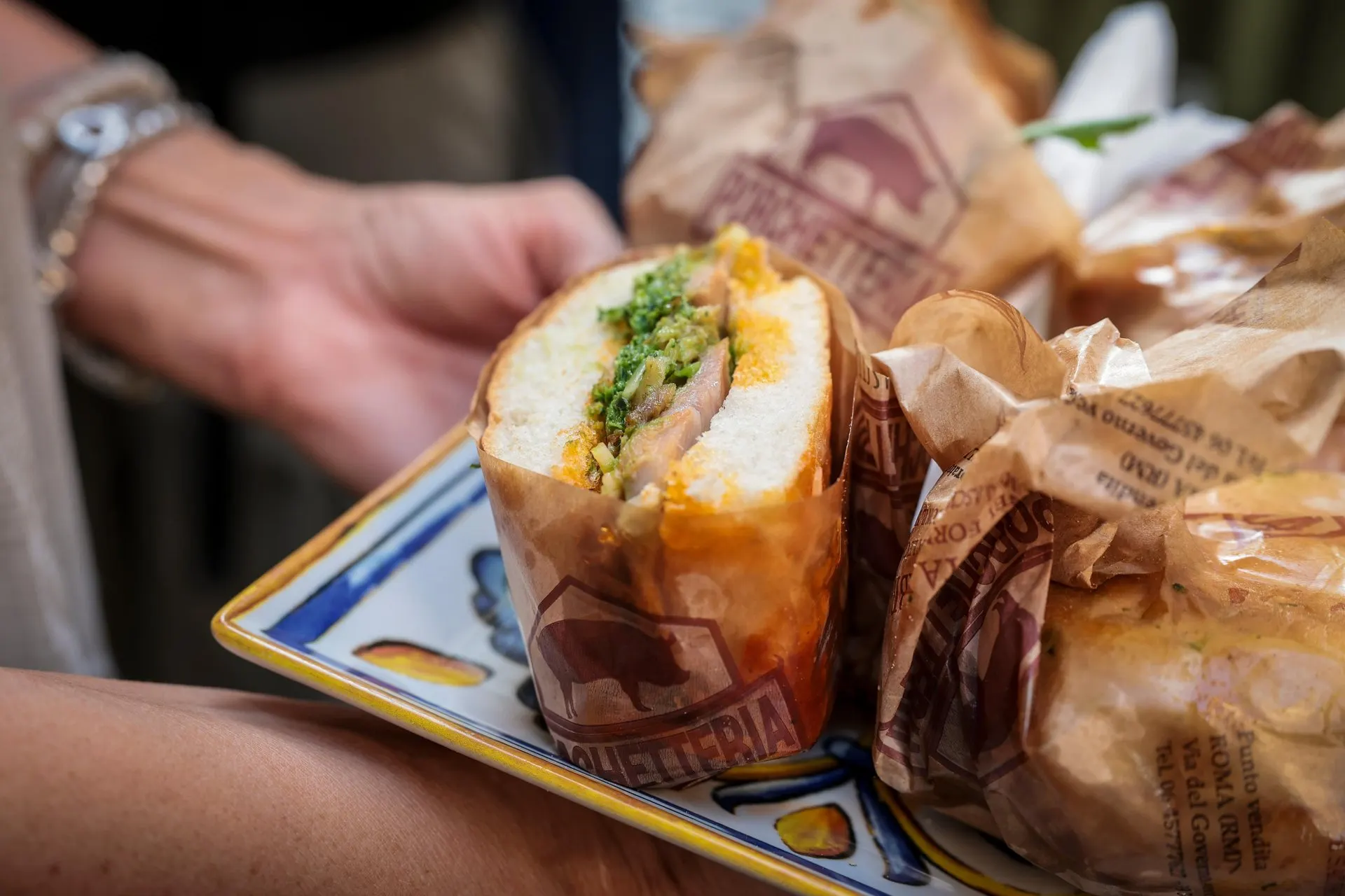 A Roman sandwich in its paper wrapper