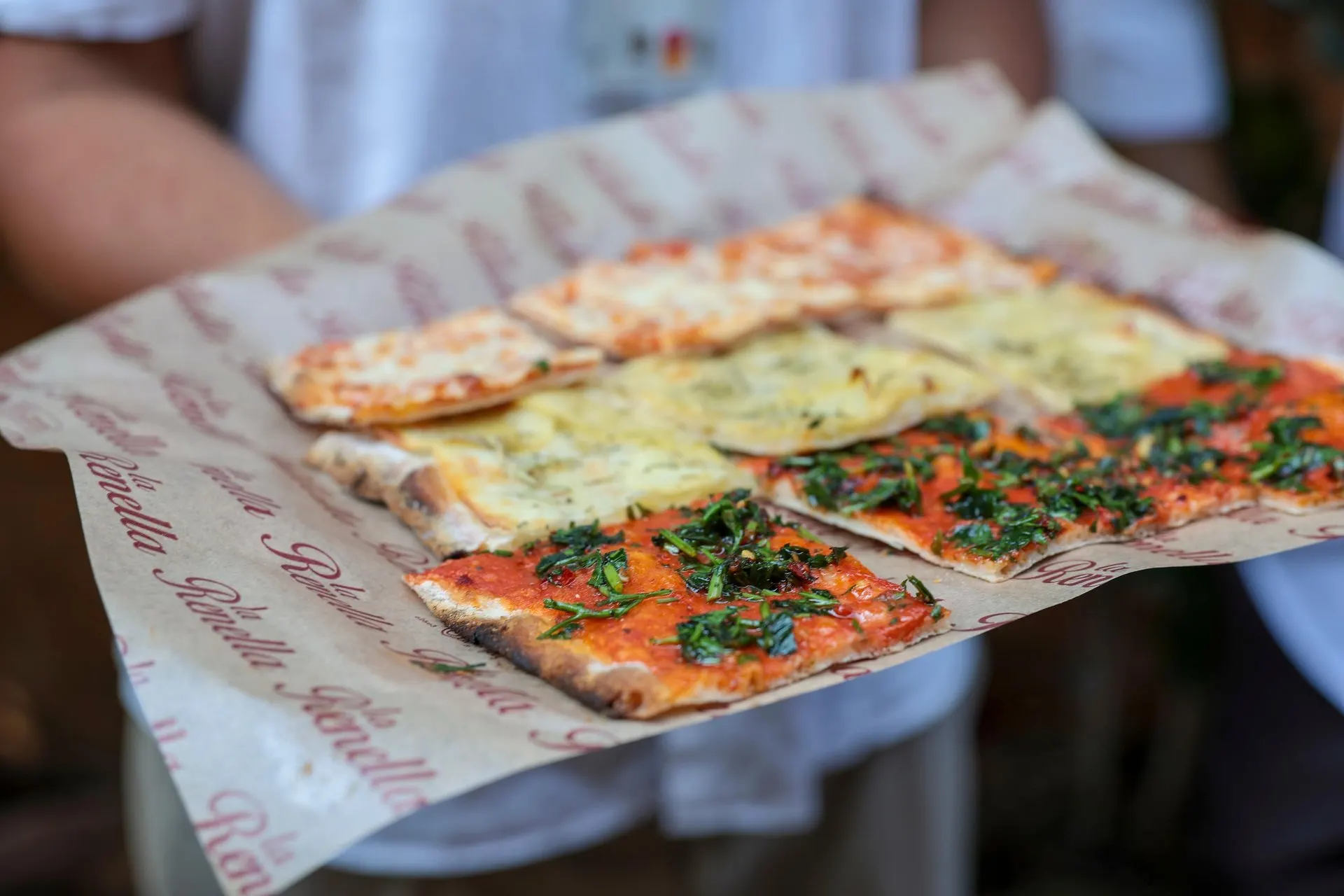 Slices of Roman pizza on wax paper