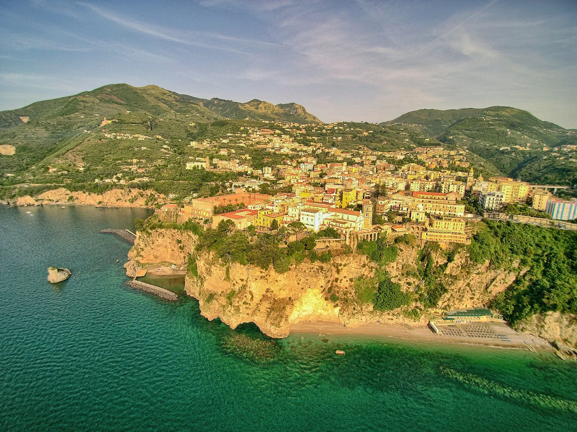 The cliffs of the Sorrento peninsula above green water near Vico Equense