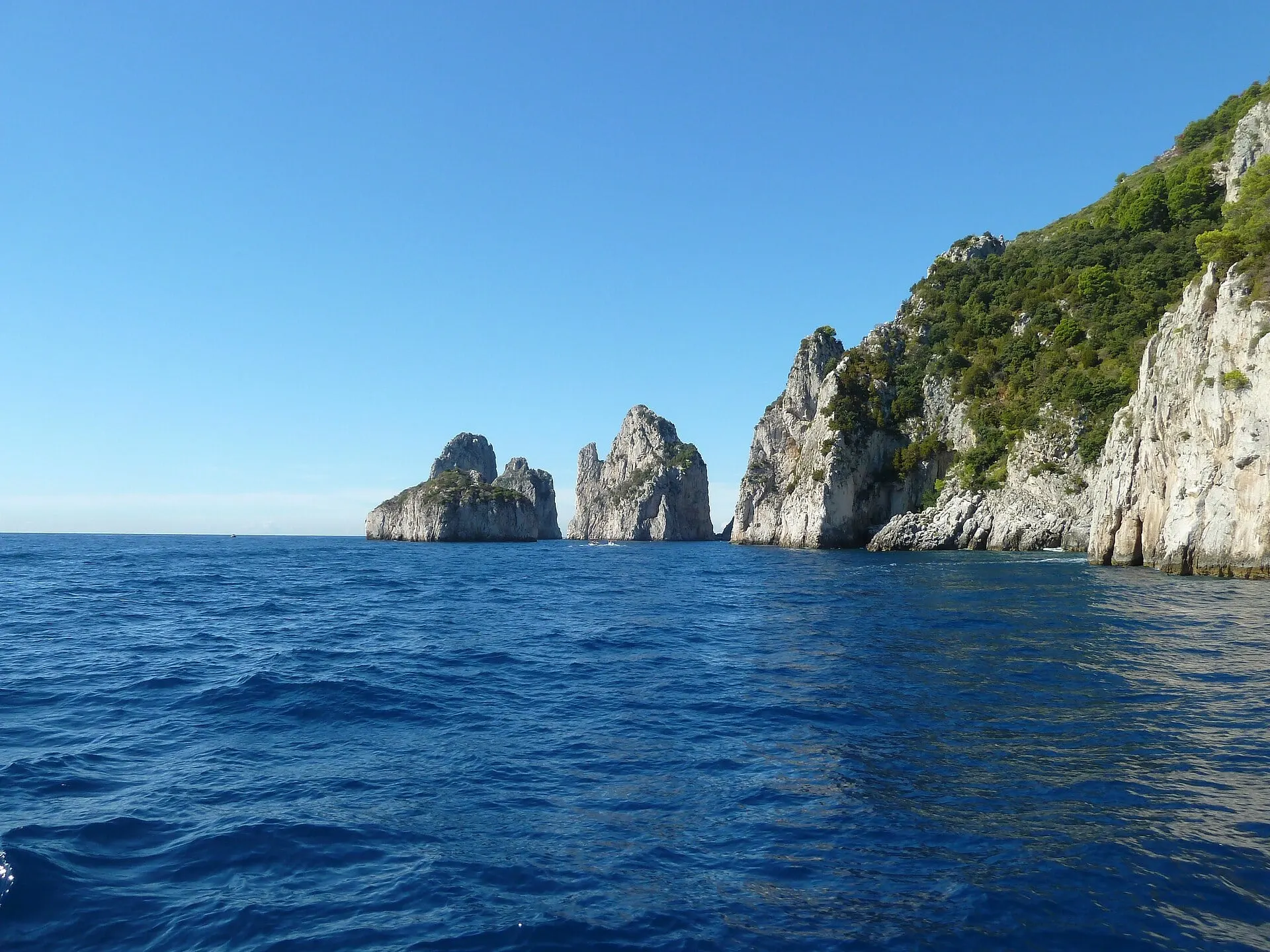 The Faraglioni rocks off Capri's south coast, seen on a boat trip around the island from Marina Grande