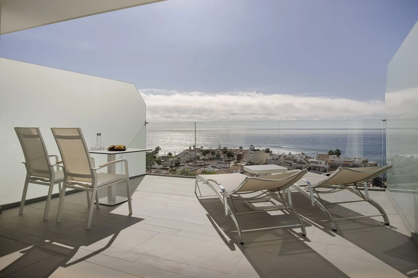 Junior Suite Sea Front Panoramic View terrace at Royal Hideaway Corales Beach: loungers, two chairs and the sea