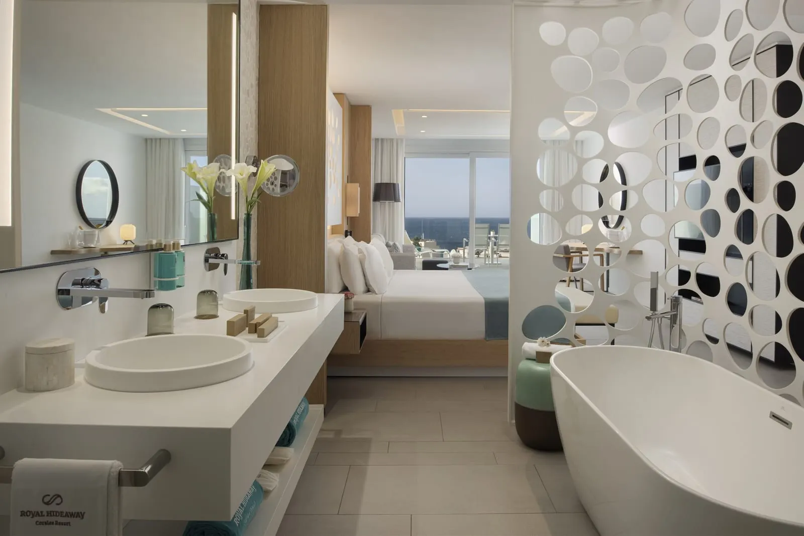 Junior Suite for Single Use at Royal Hideaway Corales Beach: twin basins and a freestanding bath open to the bedroom